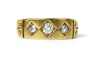 A Victorian 22ct gold three stone diamond ring,