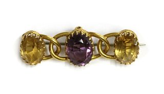 A gold amethyst and citrine brooch,