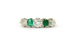 A gold diamond and emerald five stone ring,