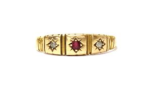 A 15ct gold ruby and diamond three stone ring,