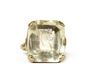 A gold intaglio engraved smoky quartz ring,