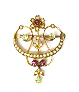 An Edwardian gold tourmaline, peridot and split pearl brooch/pendant,