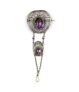 A silver Arts and Crafts amethyst and dog tooth pearl brooch, c.1910,