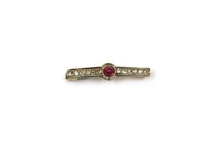 A gold ruby and diamond bar brooch,