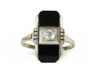 A Continental white gold diamond and onyx ring,