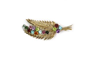 A gold assorted gemstone fern brooch,