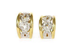 A pair of gold diamond set half hoop earrings,