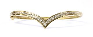 A 9ct gold diamond wishbone bangle,