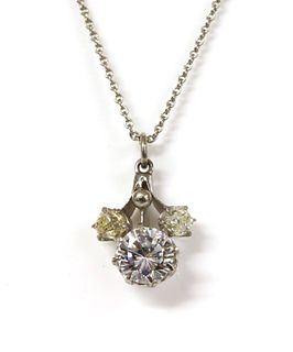 A white gold cubic zirconia and diamond pendant,