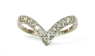 An 18ct white gold diamond set wishbone ring,