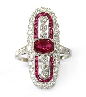 A platinum ruby and diamond fingerline cluster ring,