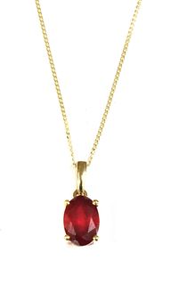 A gold single stone fracture filled ruby pendant,