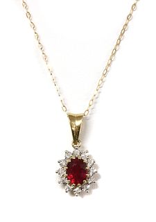 A 9ct gold fracture filled ruby and diamond cluster pendant,
