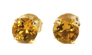 A pair of gold single stone citrine stud earrings,