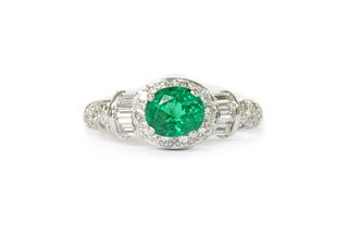 A platinum emerald and diamond cluster ring,