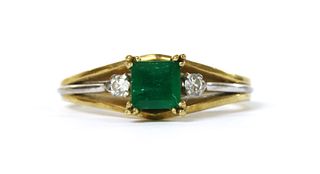 A two colour gold emerald and diamond ring,
