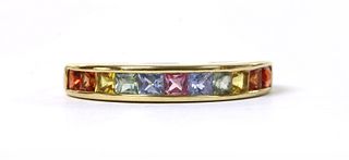 A gold rainbow sapphire half eternity ring,