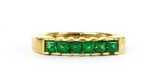 A gold six stone tsavorite garnet ring,