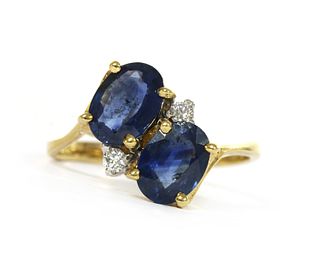 An 18ct gold sapphire and diamond crossover ring,