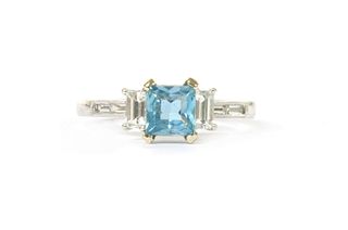 An 18ct white gold aquamarine and diamond three stone ring,