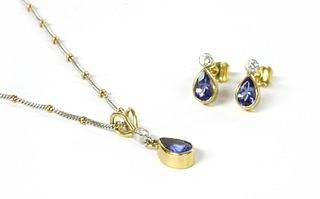 An 18ct gold tanzanite and diamond pendant and earrings suite,