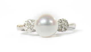 A white gold cultured freshwater pearl and diamond ring,