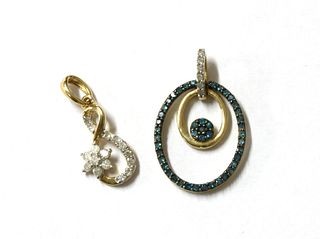 A 9ct gold diamond and treated blue diamond pendant,