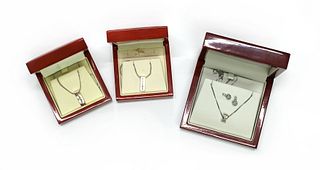 Three silver diamond set pendants, by Hot Diamonds,