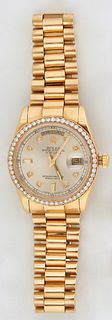 Man's Rolex Presidential 18K Yellow Gold Oyster Perpetual Day-Date Wristwatch,  Model # 118238, Serial # F602515, with a diamond bezel, and diamond mo