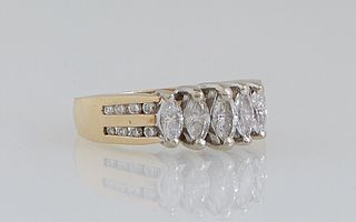 Vintage Lady's 14K Yellow Gold Gold Dinner Ring, the top with four graduated vertical marquise diamonds, the shoulders of the band with two parallel r