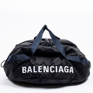 Balenciaga Duffle Bag, in black nylon with navy blue canvas woven straps, the interior of the bag lined in a similar black nylon with a zip closure si