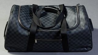 Louis Vuitton Rolling Duffle, in black damier ebene coated canvas with silvered hardware and black canvas straps, opening to a black nylon lined inter