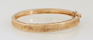 14K Yellow Gold Hinged Bangle Bracelet, with a concave Florentine finish and pierced sides, with a safety chain, H.- 1/4 in., Int. H.- 1 7/8 in., Int.