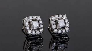 Pair of 18K White Gold Stud Earrings, each with a central round diamond, within a pierced square border of thirteen round point diamonds, on screw bac