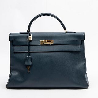 Hermes Kelly Retourne 40 Handbag, in cobalt blue calf leather with golden hardware, opening to a matching cobalt blue calf leather interior with a lon