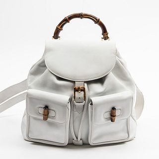Large Gucci Bamboo Backpack, in white smooth calf leather with golden hardware, opening to a beige canvas lined interior with a side zipper storage po