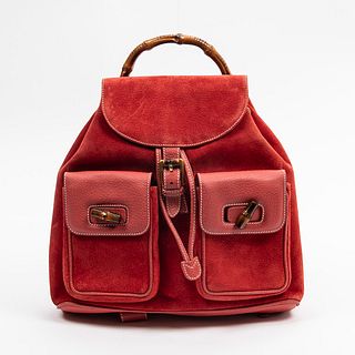 Large Gucci Bamboo Backpack, in red suede and calf leather with golden hardware, opening to a beige canvas lined interior with one side zipper closure