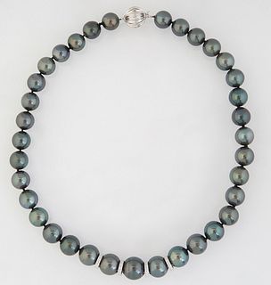 Strand of Thirty-Five Graduated Dark Gray Tahitian Cultured Pearls, ranging from 11-14mm, with a 14K white gold ball clasp, L.- 17 1/2 in., with appra