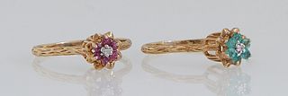 Two 10K Yellow Gold Floriform Rings, mid 20th c., one with emeralds around a center diamond; the second with rubies around the central diamond, Size 6