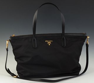 Prada Tote Bag, in black nylon with black calf leather accents and golden hardware, opening to a dusty rose woven silk blend lined interior with a sid
