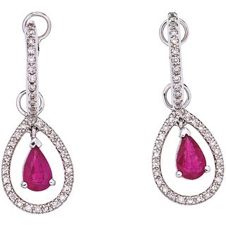 PAIR OF EARRINGS WITH RUBIES AND DIAMONDS IN 14K WHITE GOLD Pear cut rubies ~0.60 ct and 8x8 cut diamonds ~0.25 ct. Weight: 3.2 g | PAR DE ARETES CON 