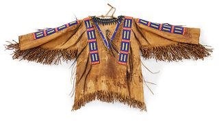 A Sioux beaded hide war shirt