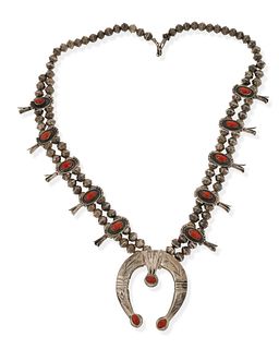 A Southwest coral and silver squash blossom necklace