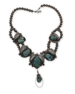 A Jimmie Nezzie Navajo turquoise and silver pendant necklace