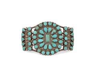 A Zuni-style silver and turquoise cluster set cuff bracelet