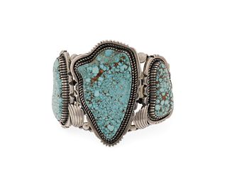 A large Howard Begay Navajo silver and turquoise cuff bracelet