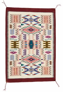 A Navajo jeweled storm pattern rug, by Lily Touchin