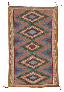 A Navajo regional raised outline rug, by Emma Yazzie