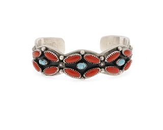 A Navajo silver and coral cuff bracelet