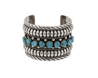 A Delbert Gordon Navajo silver and turquoise cuff bracelet